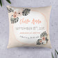 Modern tropics themed birth announcement pillow that says the baby's name, date and time of birth, weight, and length. It is orange and beige with flowers and leaves in the two opposite corners.